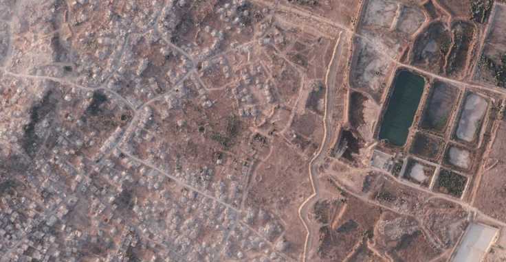 Israel is building a miles-long earthen barrier inside Gaza, entrenching its division