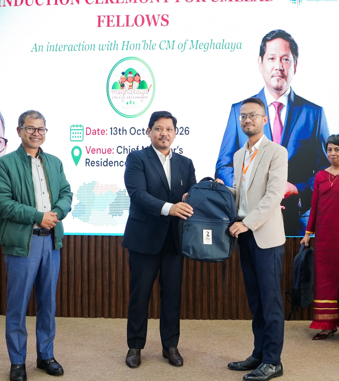 Conrad K. Sangma presents a laptop bag to a CMLEAD fellow at the induction ceremony.