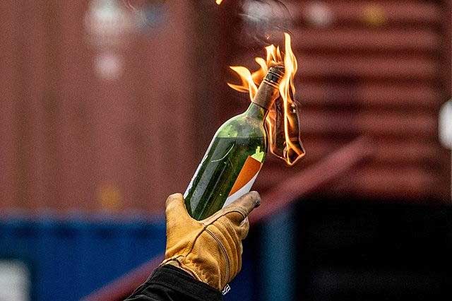 Two-wheeler catches fire in suspected petrol bomb incident